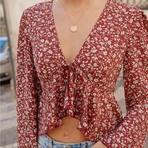 Tie front floral ruffle hem top